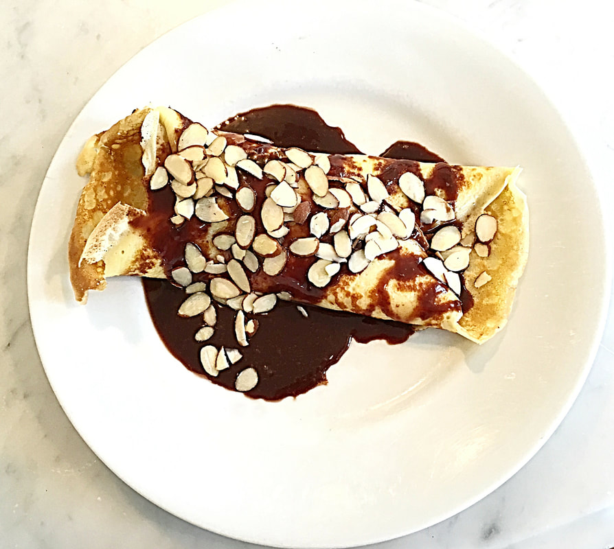 Crepe with chocolate fudge and almond slices - Cuisine Inspired